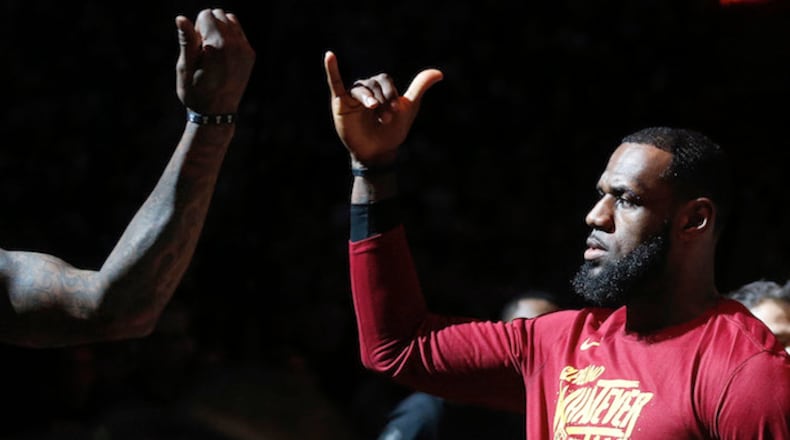Cleveland Cavaliers forward LeBron James does a handshake with teammate J.R. Smith before the start of Game 7 against the Indiana Pacers during the Eastern Conference First Round series on April 29, 2018, at Quicken Loans Arena in Cleveland. (Leah Klafczynski/Akron Beacon Journal/TNS)
