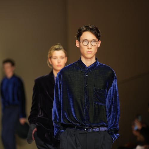 A model wears a creation as part of the Giorgio Armani Fall/Winter 2026-2027 Men's collection presented in Milan, Italy, Monday, Jan. 19, 2026. (AP Photo/Antonio Calanni)