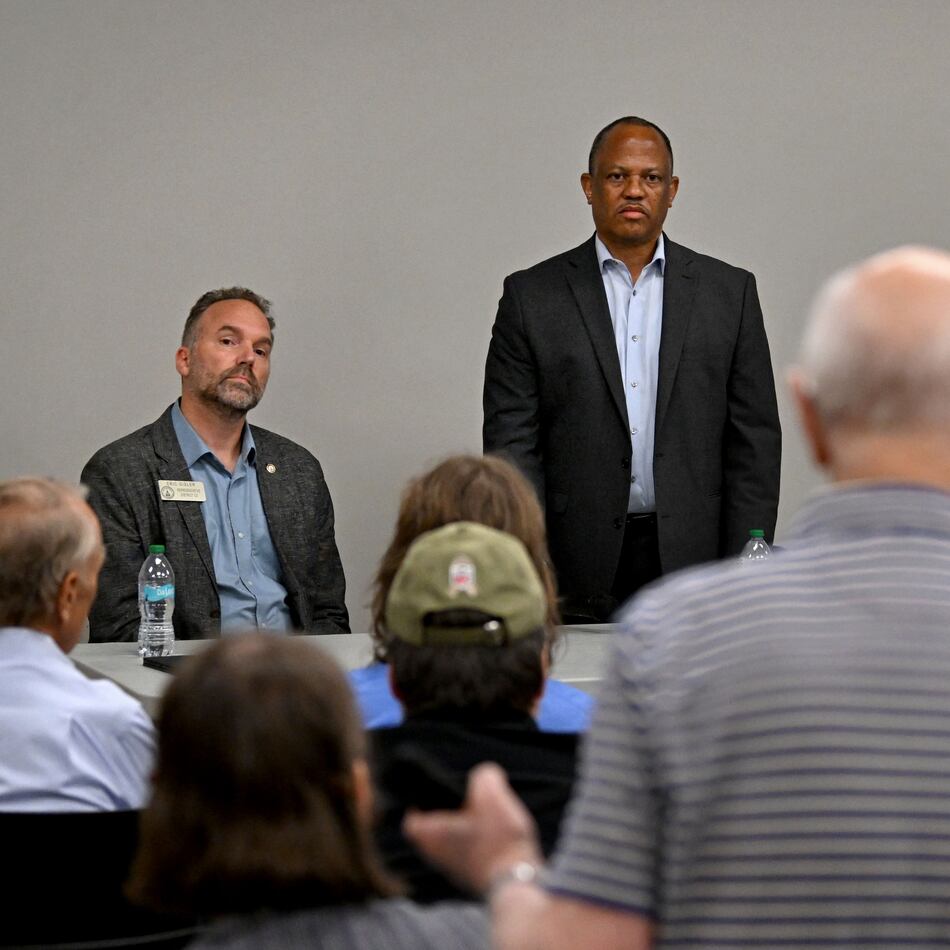 Jim Carter, foreground, questions Georgia Democratic state Reps. Eric Gisler, left, David Wilkerson, center, and Spencer Frye during a community conversation on taxes at the Bogart Library on Tuesday. The Republican-led General Assembly has focused on cutting income and property taxes. Meanwhile, a group of Democrats is touring the state to promote an alternative vision of government funding. (Hyosub Shin/AJC)
