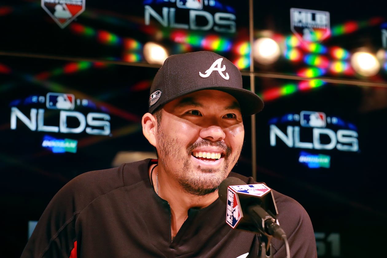 Kurt Suzuki — pictured during a news conference with the Braves during the 2018 NL Division Series —  is reportedly the new manager of the Los Angeles Angels after spending his postretirement career with the club as a special assistant to the general manager.  (Curtis Compton/AJC 2018)