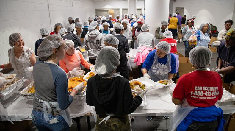 Over 1,540 volunteers work on boxing up meals during the Hosea Helps 2019 Thanksgiving Festival at the Georgia World Congress Center. STEVE SCHAEFER / SPECIAL TO THE AJC