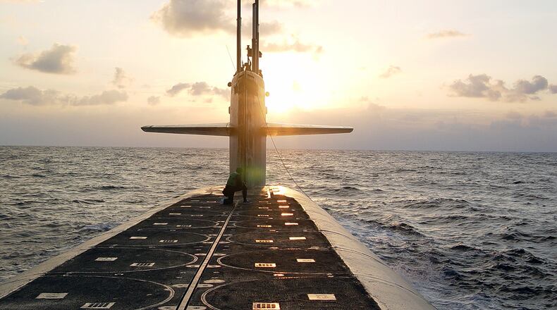 In this Jan. 9, 2008 photo released by the U.S. Navy, the Ohio-class ballistic-missile submarine USS Wyoming approaches Naval Submarine Base Kings Bay, Ga. (Lt. Rebecca Rebarich/U.S. Navy via AP)