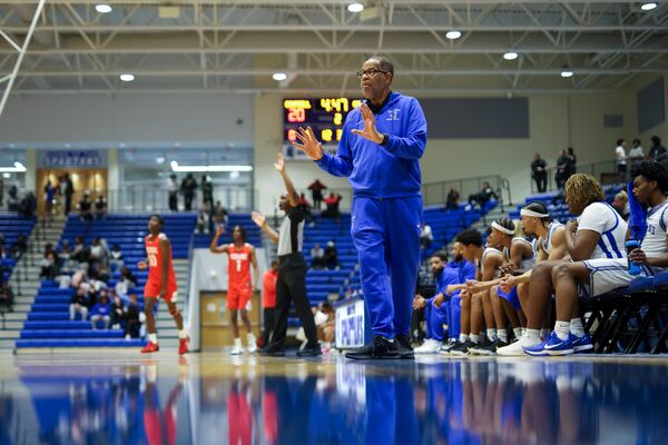 Campbell boys basketball coach James Gwyn (center) — pictured coaching against Osborne on Tuesday, Jan. 13, 2026 — said of the support he and girls basketball coach Randy McClure received after their contracts were not renewed: “The community was behind us so much. We didn’t do any of it. We were almost out of it, but the community just said, ‘No.’” (Jason Getz/AJC)