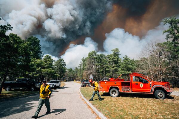 Firefighters battle a wildfire in Ocean County, N.J. on Thursday, April 24, 2025. (New Jersey Department of Environmental Protection via AP)