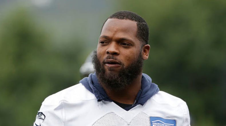 Seattle Seahawks' Michael Bennett walks on the field during the team's NFL football training camp in Renton.