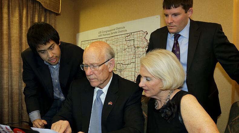 Corry Bliss, top right, previously helped GOP Sen. Pat Roberts win reelection in Kansas. He also led Karen Handel's 2014 campaign. AP Photo