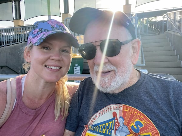 AJ Willingham with her dad, Dave, at a Jupiter Hammerheads baseball game in 2021.