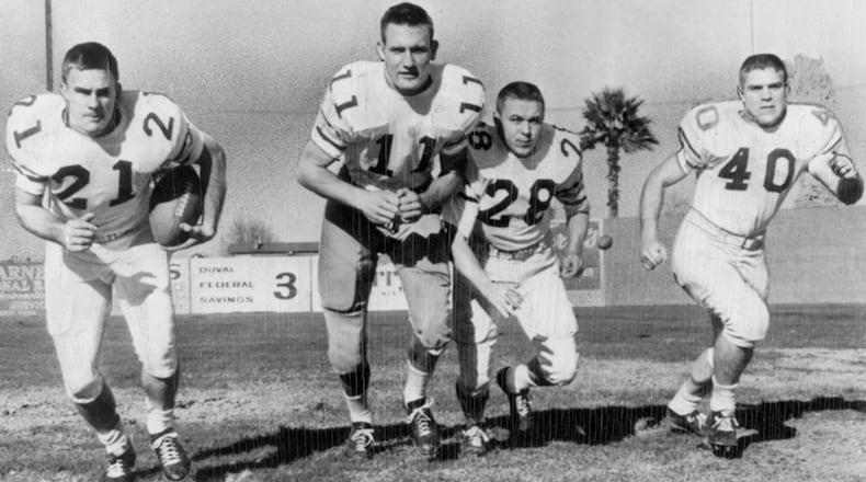 Georgia Tech's starting backfield -- halfback Paul Rotenberry (from left), quarterback Wade Mitchell, fullback Jimmy Thompson and halfback Ken Owen -- went through a final signal drill before the 1956 Gator Bowl clash with Pittsburgh in Jacksonville, Florida.