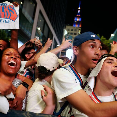 New York Knicks fans celebrate after winning Game 5 of the NBA Finals basketball series against the San Antonio Spurs, Saturday, June 13, 2026, in New York. (AP Photo/Heather Khalifa)