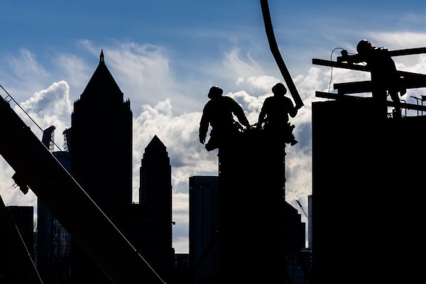 At least we got rid of the giant construction workers nesting on top of our high-rises. (John Spink/AJC)