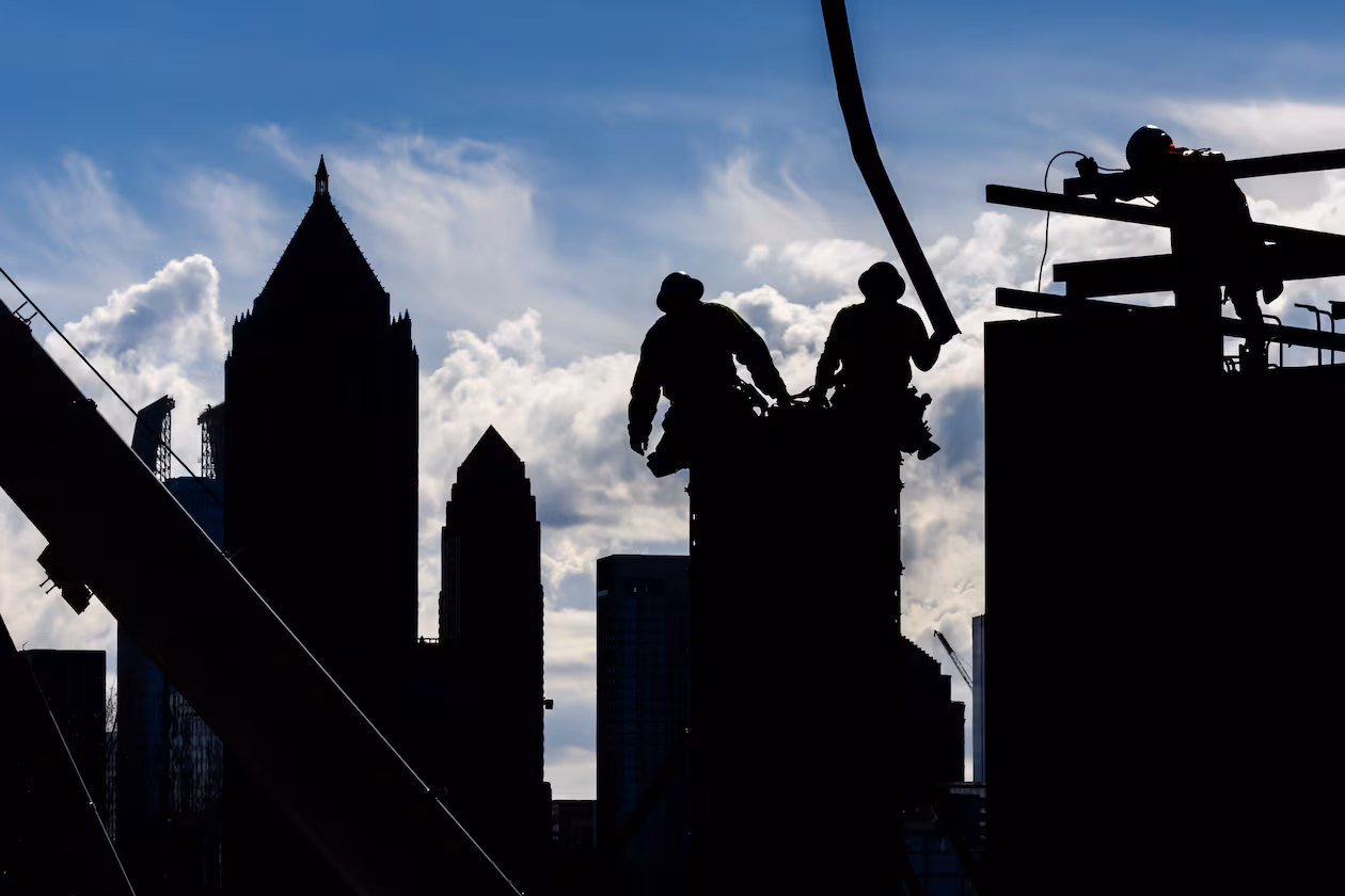 Construction workers pour concrete into forms along Bishop Street near 17th Street in West Midtown Atlanta in 2024 as they work on a mixed-use project called UrbA ATL. Much has changed over the past 30 years in Atlanta, both the city and the region, in terms of size, diversity, and population. (John Spink/AJC 2024)
