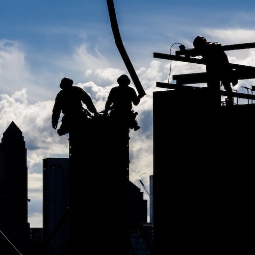 At least we got rid of the giant construction workers nesting on top of our high-rises. (John Spink/AJC)