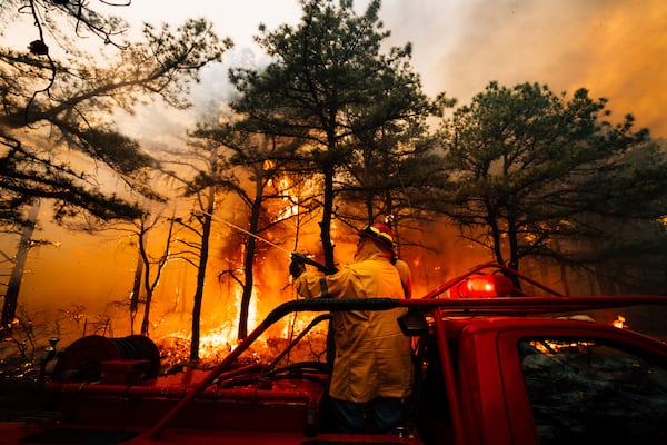 Firefighters battle a wildfire in Ocean County, N.J. on Thursday, April 24, 2025. (New Jersey Department of Environmental Protection via AP)