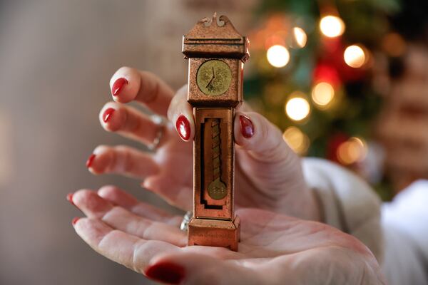Among Kathy Trocheck's holiday decorations is a custom grandfather clock made by friends. (Natrice Miller/ Natrice.miller@ajc.com)