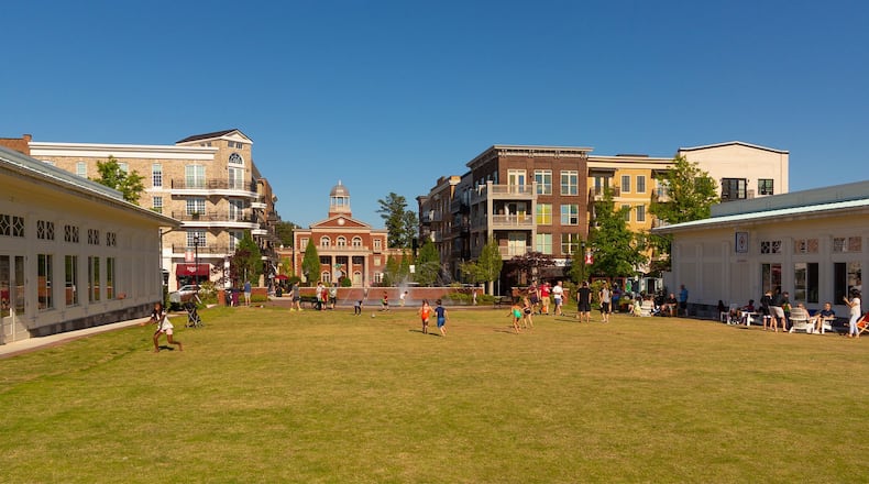 The town green at Alpharetta City Center is flanked by two restaurants in jewel box buildings, Botiwalla (left) and Chiringa (right). CONTRIBUTED BY MORRIS & FELLOWS