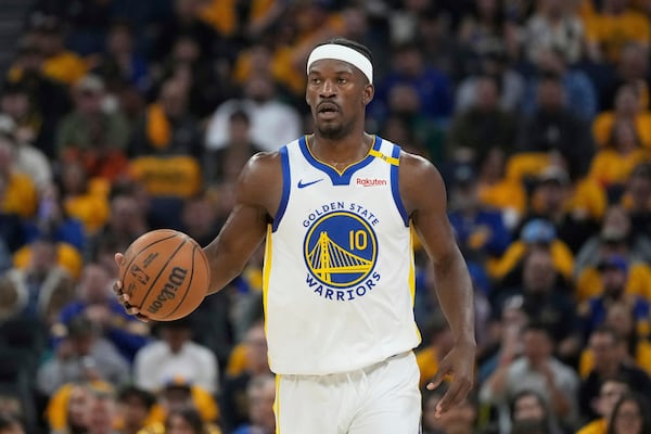 Golden State Warriors forward Jimmy Butler III brings the ball up the court against the Memphis Grizzlies during the first half of an NBA play-in tournament basketball game in San Francisco, Tuesday, April 15, 2025. (AP Photo/Jeff Chiu)