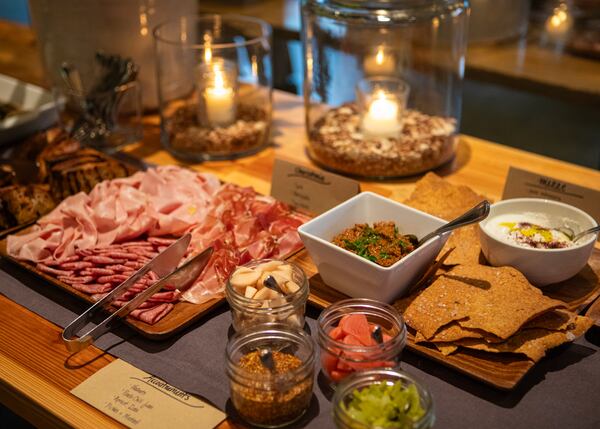 A spread of charcuterie, mezze and accouterments are laid out at Miller Union during its 15-year anniversary party in 2024. (Courtesy of Aaliyah Man)