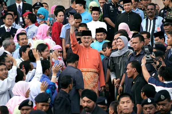 FILE - Malaysian former Prime Minister Abdullah Ahmad Badawi, center, waves as he leaves prime minister's office in Putrajaya, outside Kuala Lumpur, Malaysia, Friday, April 3, 2009. (AP Photo/Lai Seng Sin, File)