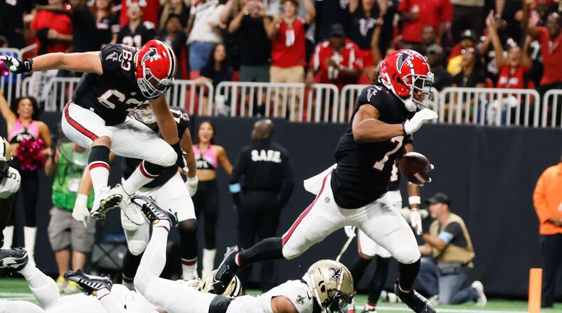 Atlanta Falcons running back Bijan Robinson (7) crosses the end zone, but a flag prevented the score during the second half of an NFL football game against the New Orleans Saints on Sunday, Sept. 29, at Mercedes-Benz Stadium in Atlanta.
(Miguel Martinez/ AJC)