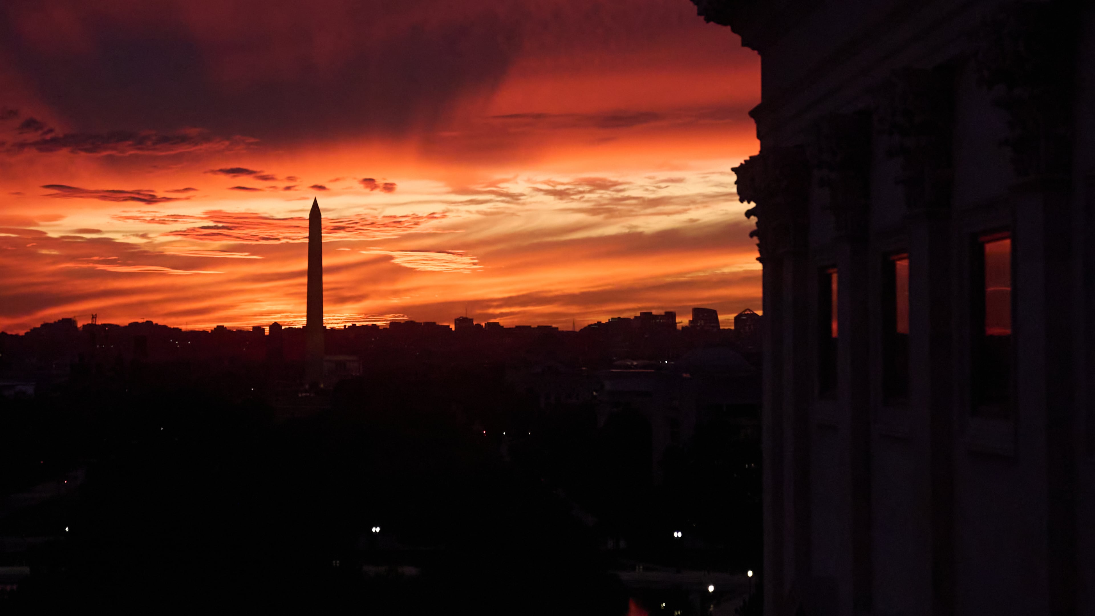 The sunset is seen from the Capitol before Republican and Democratic news conferences about the government shutdown, Tuesday, Sept. 30, 2025, on Capitol Hill, in Washington. (AP Photo/Jacquelyn Martin)