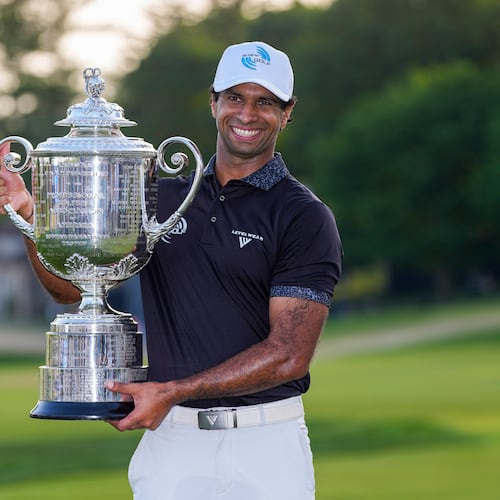 Aaron Rai, of England, holds the Wanamaker Trophy after winning the PGA Championship golf tournament at Aronimink Golf Club, Sunday, May 17, 2026, in Newtown Square, PA. (AP Photo/Matt Slocum)