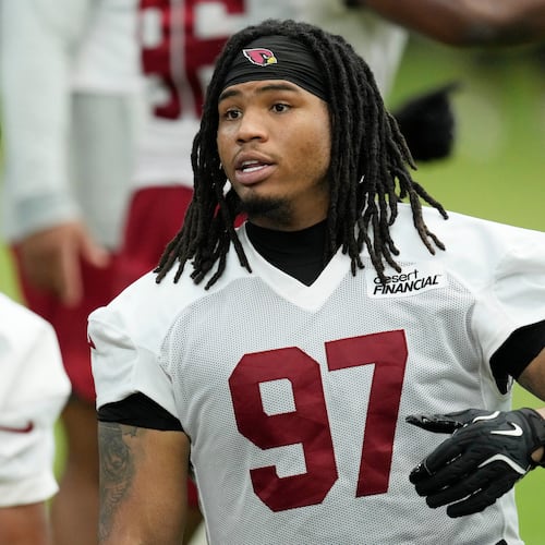 Arizona Cardinals defensive tackle Walter Nolen III (97) talks with Cardinals defensive tackle PJ Mustipher during NFL football training camp, Sunday, July 26, 2026, in Glendale, Ariz. (AP Photo/Ross D. Franklin)