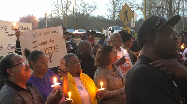 Stockbridge residents attend February candlelight prayer vigil opposing creation of city of Eagle’s Landing. LEON STAFFORD/AJC