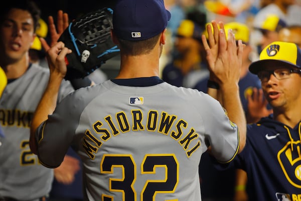Milwaukee Brewers starting pitcher Jacob Misiorowski (32) returns to the dugout after giving up a two-run home run to the Minnesota Twins in the seventh inning of a baseball game Friday, June 20, 2025, in Minneapolis. (AP Photo/Bruce Kluckhohn)