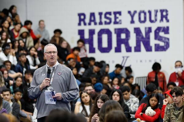 Mike Lutzenkirchen, of the Lutzie 43 Foundation, addresses hundreds of students gathered in Lakeside High's gym in March 2024 after several students died in crashes. (Miguel Martinez/AJC)
