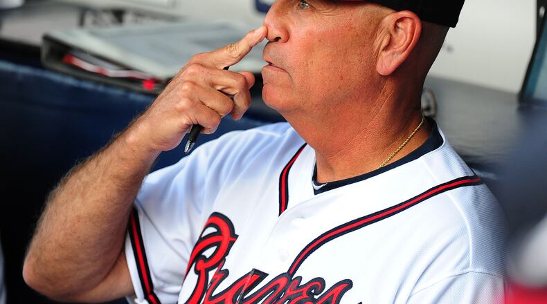 Braves interim manager Brian Snitker goes over signals before Tuesday's game against Milwaukee at Turner Field. It was Snitker's first home game since taking over for Fredi Gonzalez. (Scott Cunningham / Getty Images)