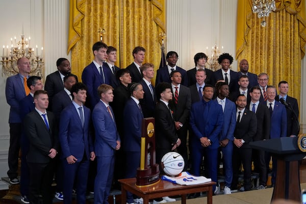 Members of the team arrive on stage as President Donald Trump hosts the 2025 NCAA Champion, University of Florida men's basketball team in the East Room of the White House, Wednesday, May 21, 2025, in Washington. (AP Photo/Julia Demaree Nikhinson)