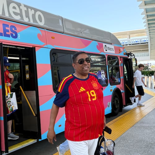 Fans exit a Metro shuttle after a World Cup match between Spain and Austria on Thursday, July 2, 2026, in Los Angeles. (AP Photo/Jaimie Ding)