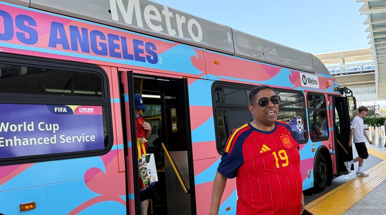 Fans exit a Metro shuttle after a World Cup match between Spain and Austria on Thursday, July 2, 2026, in Los Angeles. (AP Photo/Jaimie Ding)