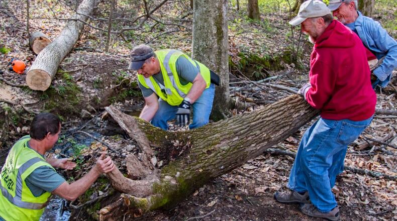 On Park Day 2017, volunteers remove part of a stump from a creek at Kennesaw Mountain National Battlefield Park. CIVIL WAR TRUST