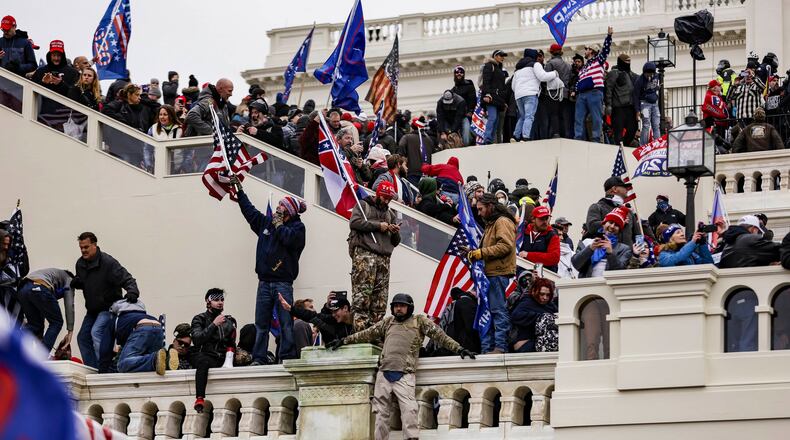 Pro-Trump supporters storm the U.S. Capitol following a rally with President Donald Trump on Jan. 6. Trump's second impeachment trial will begin Tuesday, and Georgia will figure in the proceedings. (Samuel Corum/Getty Images/TNS)