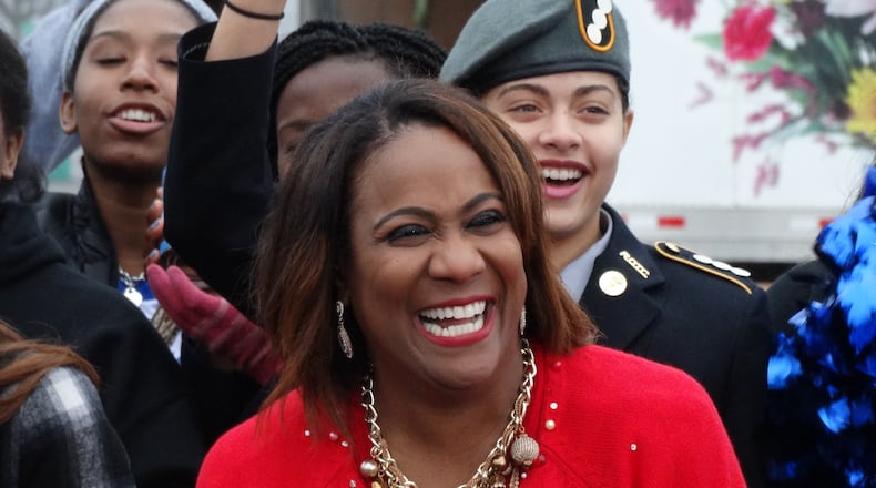 Karyn Greer with her Christmas sweater during the Can-a-Thon for the Salvation Army. CREDIT: Rodney Ho/rho@ajc.com