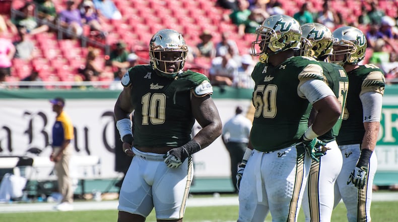 USF defensive tackles Deadrin Senat (10) and Bruce Hector against East Carolina.