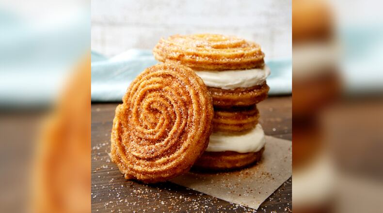 Cinnabon has introduced the Churro Swirl and Churro Frosting Sandwich (pictured) plus a Churro Ice Cream Sandwich with Carvel ice cream. (Photo by Cinnabon)
