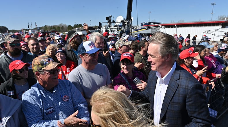 March 26, 2022 Commerce - David Perdue walks in during a rally for Georgia GOP candidates at Banks County Dragway in Commerce on Saturday, March 26, 2022. (Hyosub Shin / Hyosub.Shin@ajc.com)