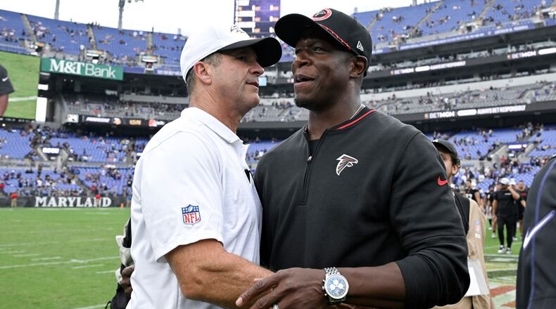 Baltimore Ravens head coach John Harbaugh, left, greets Atlanta Falcons head coach Raheem Morris after an preseason NFL football game, Saturday, Aug. 17, 2024, in Baltimore. (AP Photo/Terrance Williams)