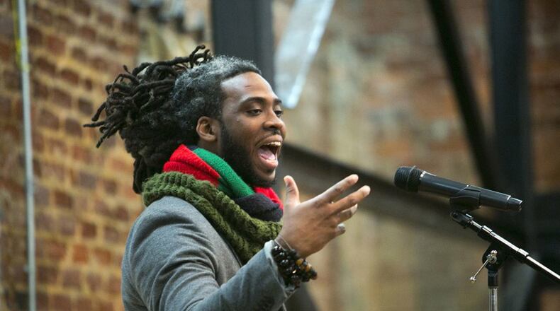 Adan Bean performs at a poetry slam at the Roswell Historic Cottage during the 2017 Roswell Roots festival  JASON GETZ / AJC FILE