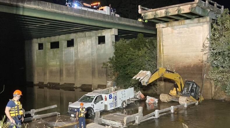 A man was killed and two others were seriously injured when a portion of a bridge collapsed Tuesday in Newton County.