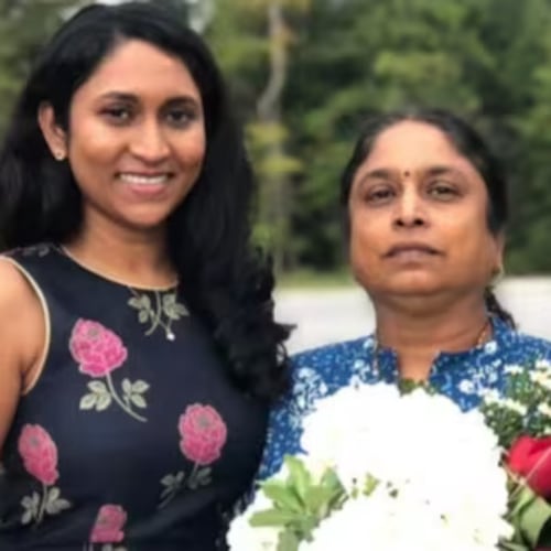 Venkata Vasamsetty, center, with her two daughters. Vasamsetty has lived legally in the country with a green card for 30 years and is a public school special education teacher. She is now in ICE custody. (Courtesy of Helen Parsonage)