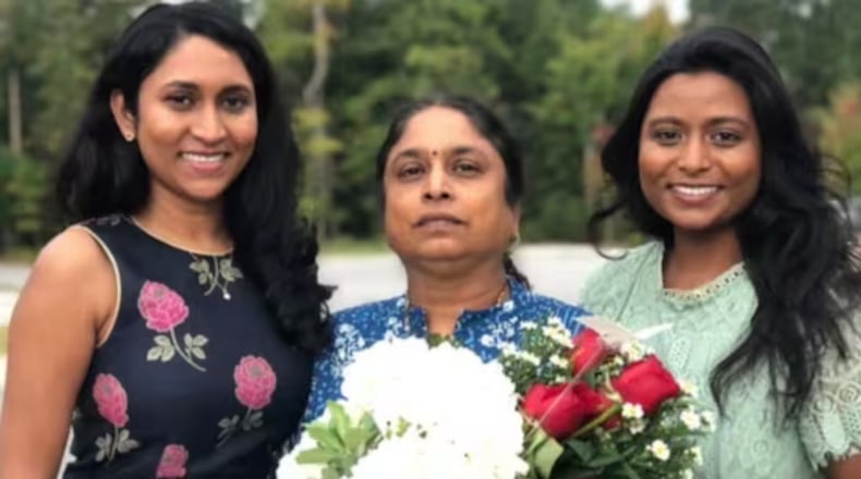 Venkata Vasamsetty, center, with her two daughters. Vasamsetty has lived legally in the country with a green card for 30 years and is a public school special education teacher. She is now in ICE custody. (Courtesy of Helen Parsonage)