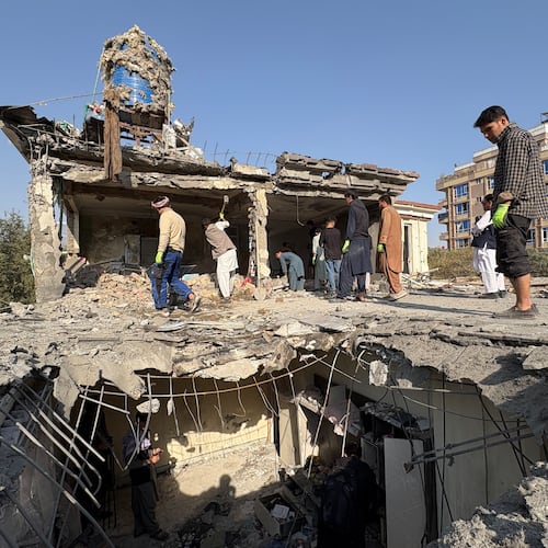 Residents remove debris from a house damaged by Wednesday's two drone strikes, in Kabul, Afghanistan, Thursday, Oct. 16, 2025. (AP Photo/Siddiqullah Alizai)