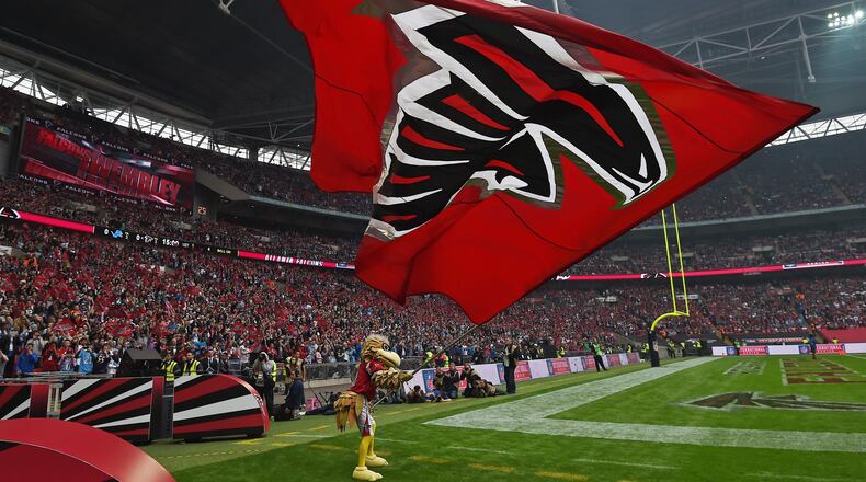 Atlanta Falcons mascot leads the team onto the field to face the Detroit Lions Sunday, Oct. 26, 2014, at Wembley Stadium, London. (Tim Ireland/AP)