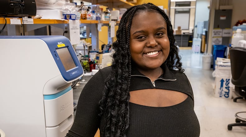Emory University junior Hasset Nurelegne poses for a photograph in her workspace at the O. Wayne Rollins Research Center on the Emory campus Tuesday, Mar 12, 2023.  (Steve Schaefer/steve.schaefer@ajc.com)