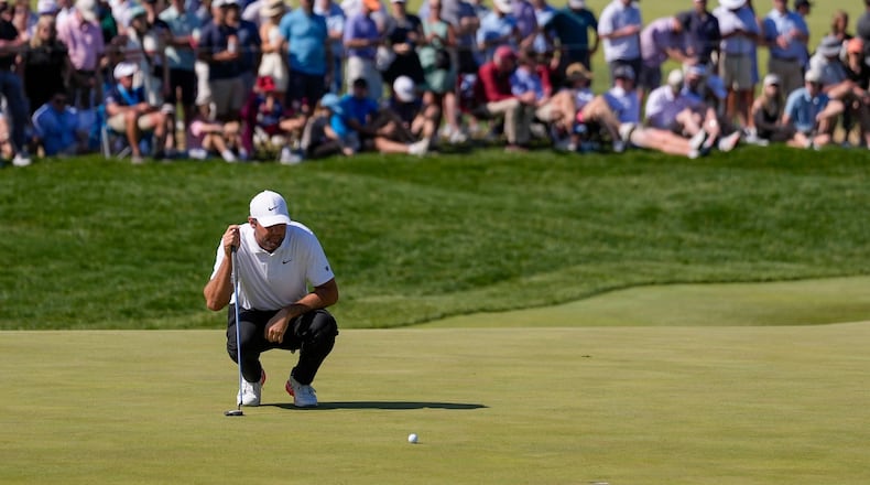 Scottie Scheffler lines up his shot on the 10th green during the third round of the PGA Championship golf tournament at Aronimink Golf Club, Saturday, May 16, 2026, in Newtown Square, PA. (AP Photo/Matt Slocum)
