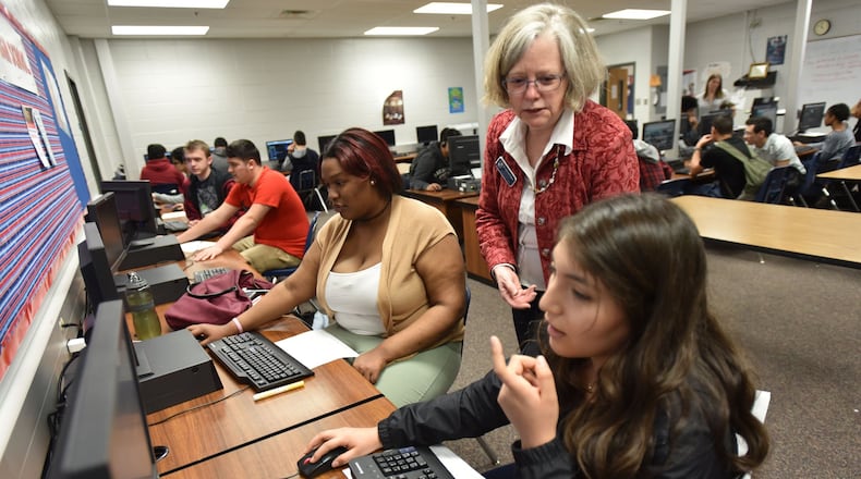 March 21, 2017 Atlanta - Dr. Leah dee Kilgore, STEM instructor, teaches her students Katherine Hernandez (right), 16, during AP Computer Science Principles class at Berkmar High School on Tuesday, March 21, 2017. Some metro Atlanta schools are a testing ground for the latest effort to get more girls and non-white students interested in computer science. The College Board has created a new Advanced Placement course called Computer Science Principles. HYOSUB SHIN / HSHIN@AJC.COM