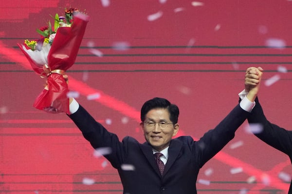 South Korea's former Labor Minister Kim Moon Soo celebrates after winning the nomination as the presidential election candidate during the People Power Party's convention in Goyang, South Korea, Saturday, May 3, 2025. (AP Photo/Ahn Young-joon)